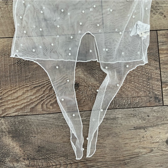 Off-White mesh long sleeve mock neck crop top with front tie and pearl details. - Picture 3 of 6